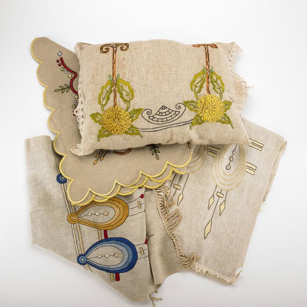 ARTS & CRAFTS TEXTILES: ARTS & CRAFTS TEXTILES; Two table runners and valance, all with embroidery, and a pillow with applied floral design; Longest: 7''