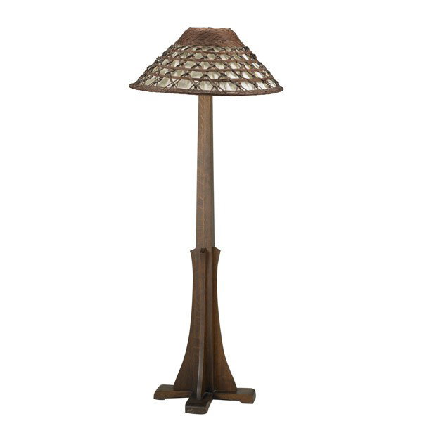 ARTS & CRAFTS: ARTS & CRAFTS; Tapering oak floor lamp with shoe feet and long buttresses, Stickley-style wicker and silk shade; 65'' x 18'' dia.