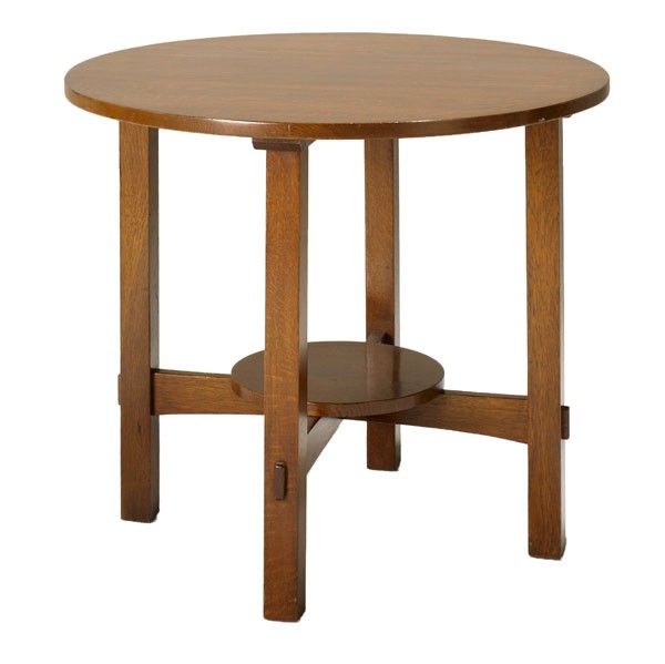 CHARLES STICKLEY : CHARLES STICKLEY; Lamp table with cloud lift stretchers and round lower shelf; Remnants of label, refinished and some loss of height; 26'' x 30'' dia.