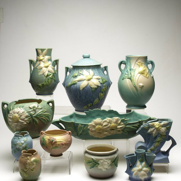 ROSEVILLE : ROSEVILLE; Four pieces blue Clematis, Peony console and handled vase, two pieces Poppy, Gardenia and two White Rose; All impressed marks; Cookie jar: 10 1/2'' x 9 1/2'' dia.