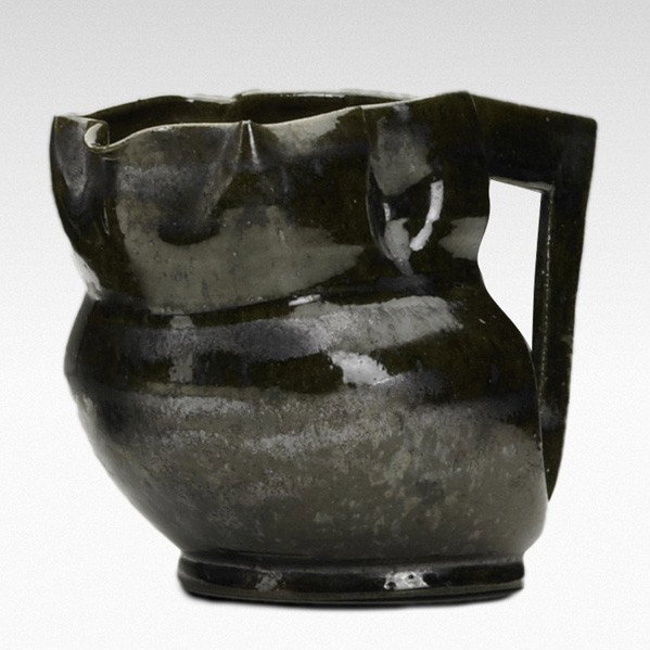 GEORGE OHR; Lobed pitcher: GEORGE OHR; Lobed pitcher, green and gun metal glaze; Signed G.E.OHR, Biloxi, Miss.; 3 1/2'' x 5'' x 3 1/4''