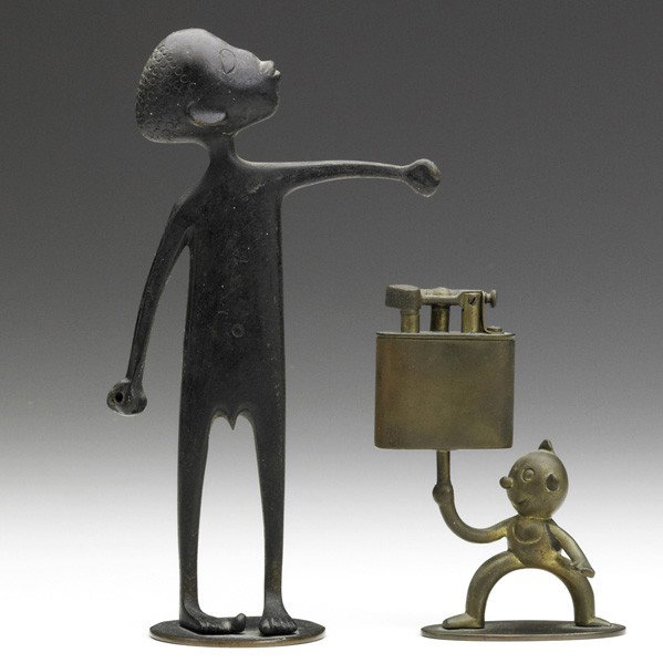 WERKSTATTEN HAGENAUER; Two figurines: WERKSTATTEN HAGENAUER; Two figurines: one African boy and one cartoon character with lighter, Austria, 1920s; Patinated brass; Stamped HAGENAUER WIEN/MADE IN AUSTRIA/Handmade, with Hagenauer mark; 4''