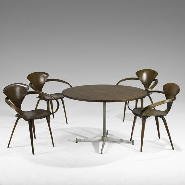 NORMAN CHERNER; PLYCRAFT; Table and armchairs: NORMAN CHERNER; PLYCRAFT; Dining table and four armchairs, 1950s; Laminated walnut and aluminum; Foil labels; table: 27'' x 42'' dia., chair: 31'' x 25 '' x 21''