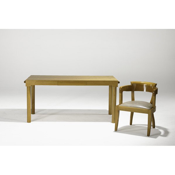 CHRISTIAN LIAIGRE; Desk and armchair: CHRISTIAN LIAIGRE; Desk and armchair, France, 1988; Desk features leather clad extension; Elm and leather; Branded; Desk: 30" x 66" x 29 1/2", opened: 89 1/2", chair: 30" x 24" x 24"