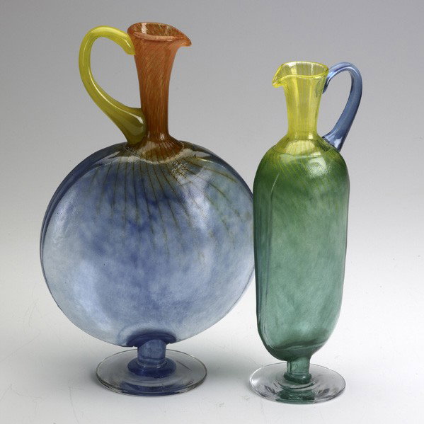 KJELL ENGMAN / KOSTA BODA: KJELL ENGMAN; KOSTA BODA; Two glass pitchers; Engraved marks; Largest: 13 3/4''