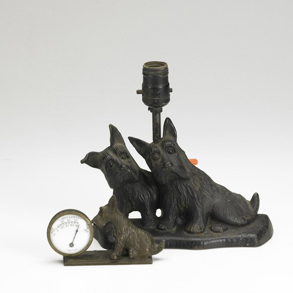DECORATIVE SCOTTIE DOGS: DECORATIVE SCOTTIE DOGS; Two pieces: cast-iron doorstop converted to a lamp together with a bronze patinated white metal thermometer; Doorstop marked NSM Co.; Taller: 9''