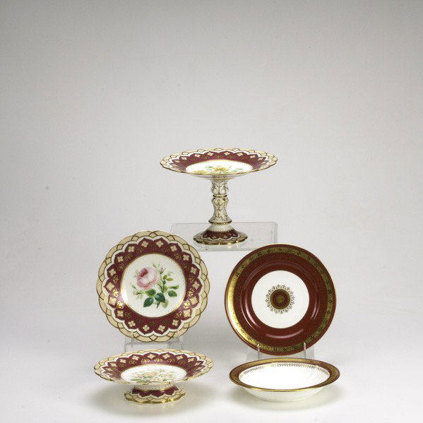 EUROPEAN PORCELAIN: EUROPEAN PORCELAIN; Thirty-four pieces: twelve 8 3/8'' lobed bowls with partial gilt fuchsia borders and ten 8 3/4'' plates with fuchsia borders and center medallion, Minton for Cilman Collamore, etc.
