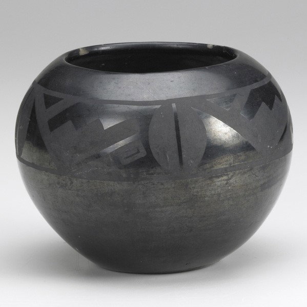 TWO NATIVE AMERICAN ITEMS: NATIVE AMERICAN; Two pieces: Maria Martinez blackware bowl with geometric design, signed Marie and Julian; Navajo area rug in red with arrow decoration, both 20th c.; Pot: 5'' x 6 1/2'' dia., rug: 37 
