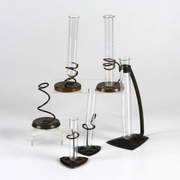 ROYCROFT: ROYCROFT; Six early and unusual bud vases some patinated, polished and hammered, two with dogwood decoration and four with glass inserts; Most with Orb & Cross mark; Tallest: 9 1/4''