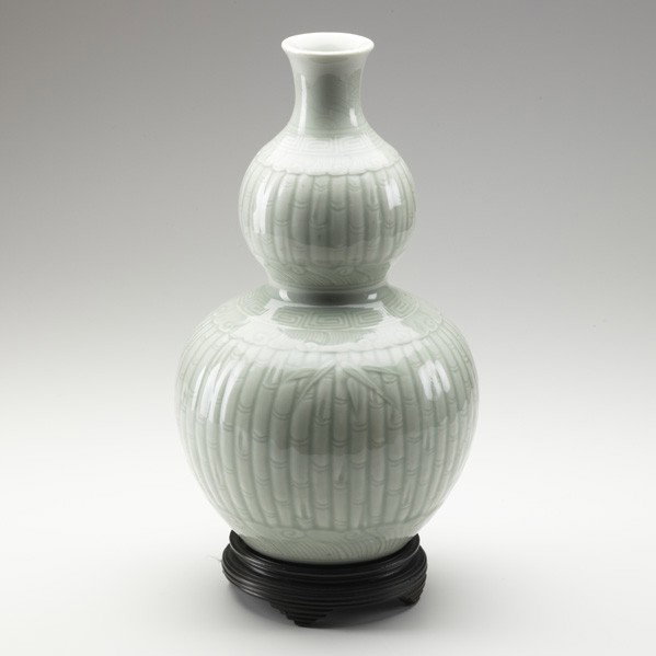 CHINESE DOUBLE GOURD VASE: CHINESE DOUBLE GOURD VASE; Celadon glaze decorated with bamboo motif, Jingdezhen, Jiangxi Province, 19th c.; Six character Qianlong mark on the base; 14 1/2''; Provenance: Christie's New York, 1982, P