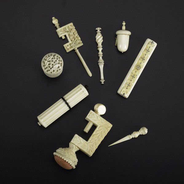 IVORY OR BONE SEWING UTENSILS: IVORY OR BONE SEWING UTENSILS; Eight pieces, 19th/20th c.: needle case with ebony, sewing clamp, point with protector, acorn-shaped tape measure, small picker, carved clamp, needle case with faceted s