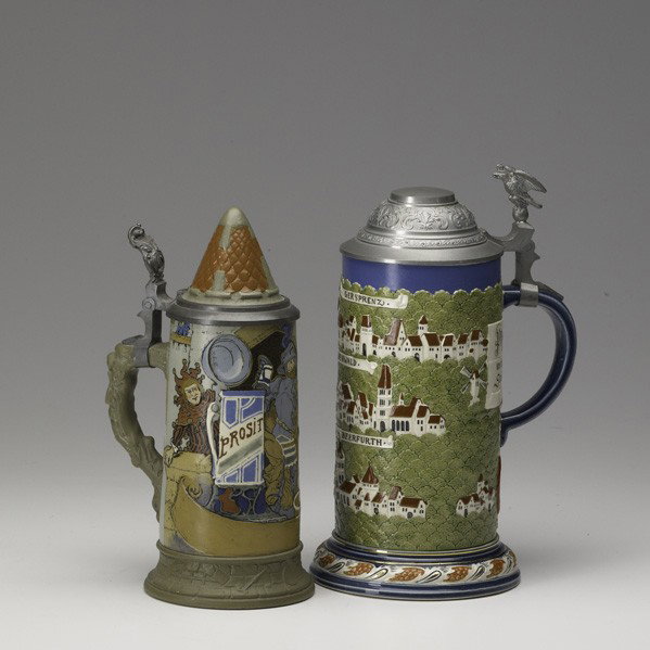 METTLACH: METTLACH; Two steins, early 20th c.: no. 2829 one litre and no. 2580 etched ''Prosit''; Taller: 10 3/4''
