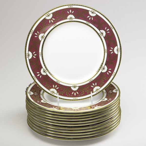 MINTON / TIFFANY & CO.: MINTON; TIFFANY & CO.; Set of twelve dinner plates with flower and vine gilt decoration on fuschia ground, 20th c.; Marked; 10 5/8'' dia.