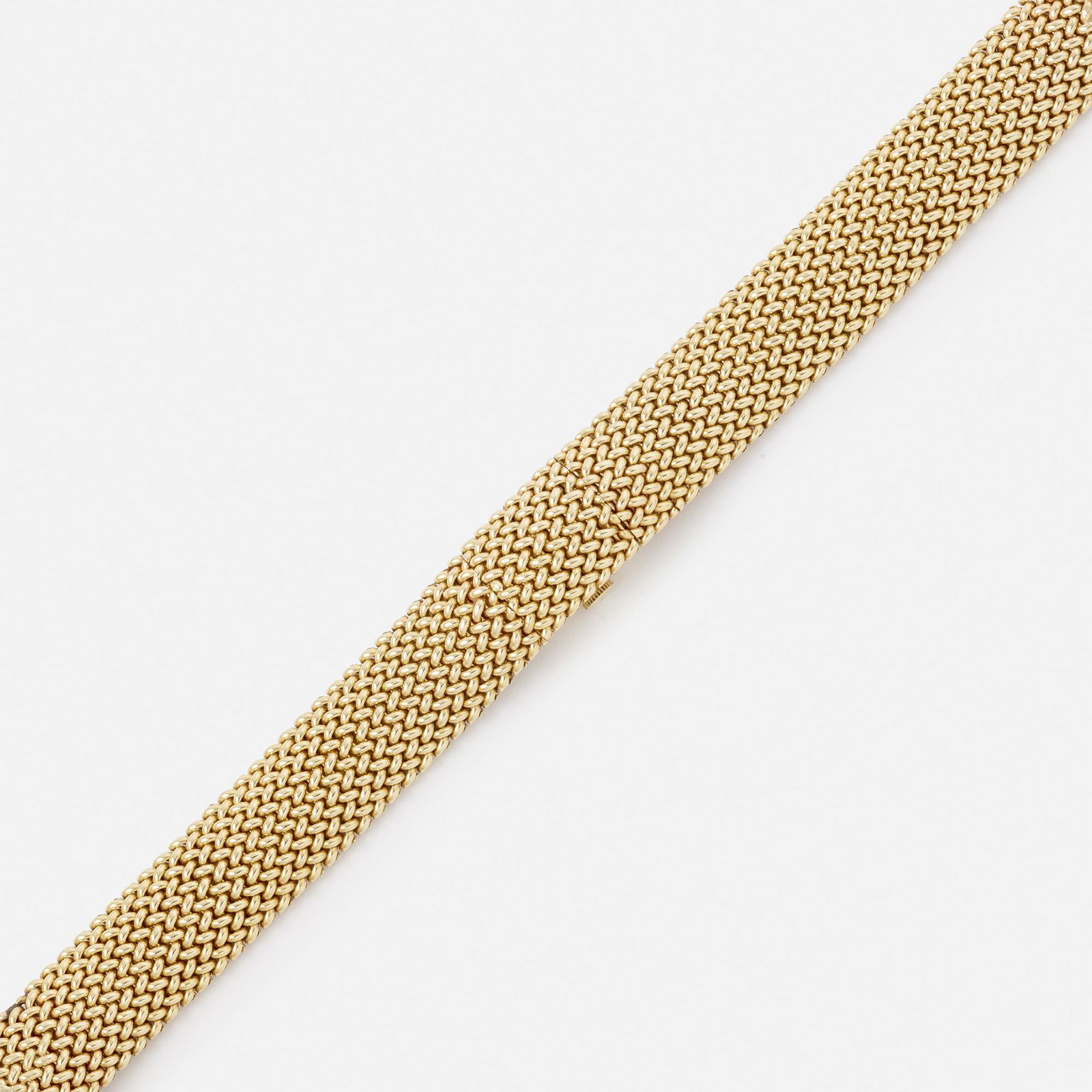 Movado, Gold hidden watch bracelet: Movado Gold hidden watch bracelet The fancy woven gold bracelet with a hidden rectangular dial with baton hours 14k yellow gold Manual wind Case size 15 x 12 mm Signed Movado to dial 7.25 x