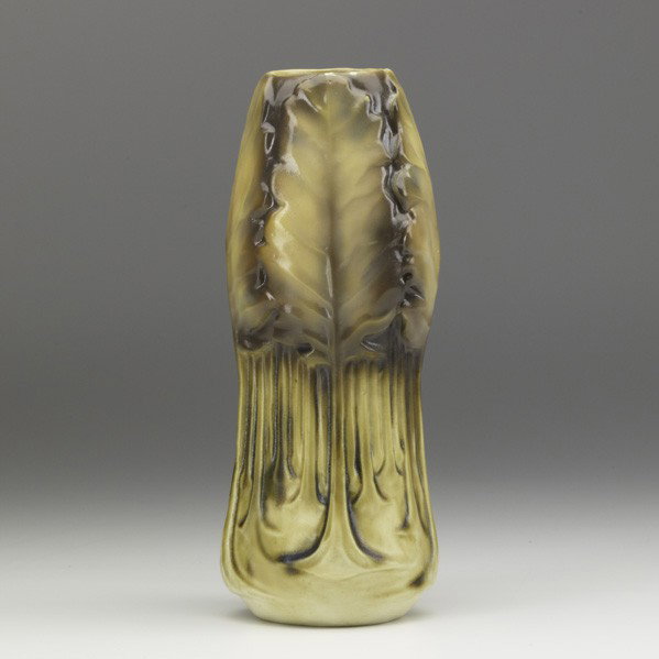L. C. TIFFANY; Glazed ceramic vessel: TIFFANY STUDIOS; Glazed ceramic vessel in Old Ivory glaze; Inscribed L. C. T. 909; 9 1/2'' x 3 1/2''