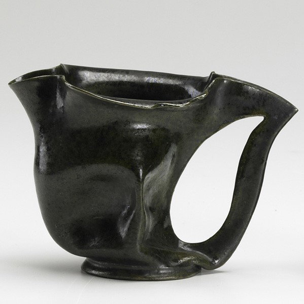 GEORGE OHR; Pitcher: GEORGE OHR; Pinched pitcher with green mottled glaze; Stamped G.E. Ohr Biloxi Miss; 4'' x 6 1/2''