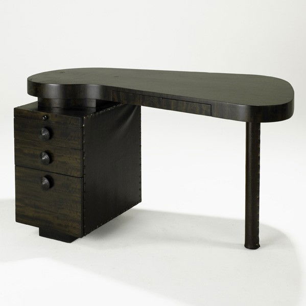 GILBERT ROHDE; HERMAN MILLER; Paldao desk: GILBERT ROHDE; HERMAN MILLER; Paldao desk, USA, 1940s; Paldao, faux snake skin, brass tacks; Unmarked; 29'' x 52'' x 31''