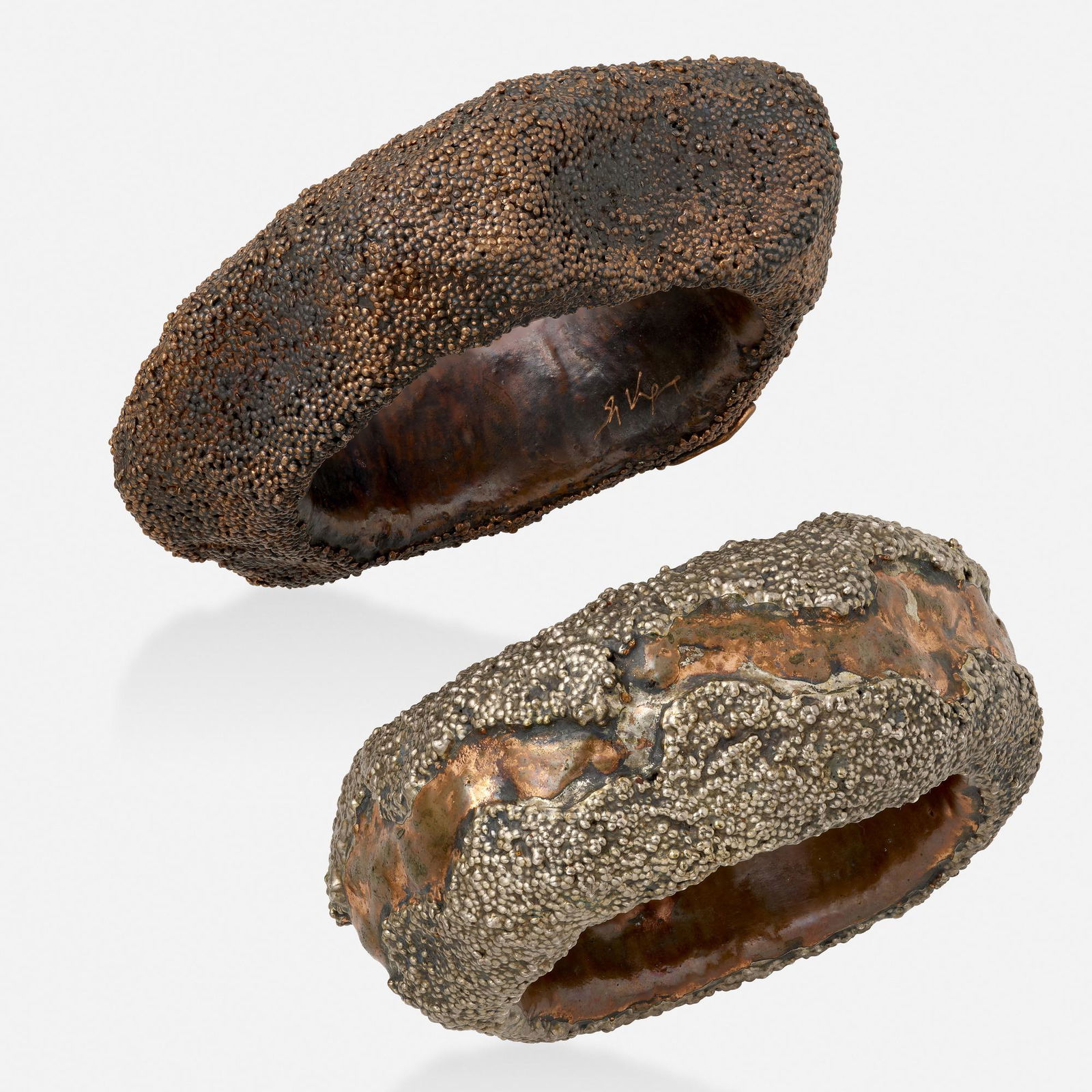 Giorgio Vigna, Two silver and copper bangles: Giorgio Vigna Two silver and copper bangle bracelets Of undulating form, with granulation details Part of the Sasso Collection Oxidized silver and copper Signed Giorgio Vigna Inner circ. 8 in. wi