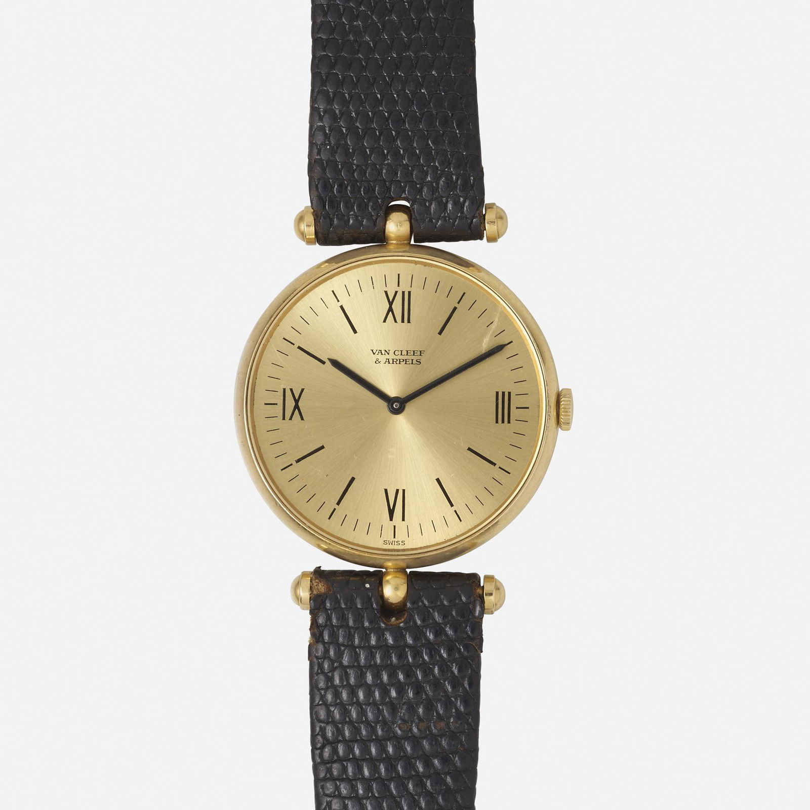 Van Cleef & Arpels, Gold wristwatch: Van Cleef & Arpels Gold wristwatch The round dial with Roman numeral and baton hours in a gold case, to the leather strap Manual wind Case size 30 mm 18k yellow gold Signed Van Cleef & Arpels
