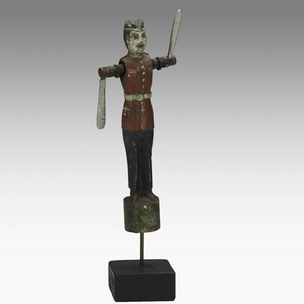 FOLK ART WHIRLIGIG: FOLK ART WHIRLIGIG; Soldier with club paddles and painted decoration mounted on wood stand, 19th c.; 12 1/2''