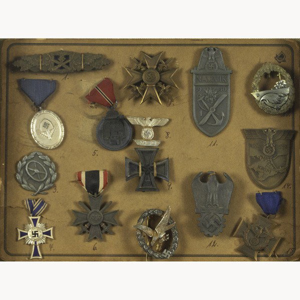WORLD WAR II GERMAN MILITARY DECORATION: WORLD WAR II GERMAN MILITARY DECORATIONS; Sixteen items include fifteen medals and Kriegsverdienstkreuz 2. Klasse award with autopen signature of Adolph Hitler and reproduced "Reichmarshal Herman Goer