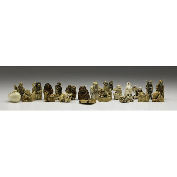 ASIAN IVORY CARVINGS: ASIAN IVORY CARVINGS; Twenty-two netsuke and okimono, 20th c.: includes monkeys, skulls, scholars, hatching egg, etc.; Tallest: 2 1/4''