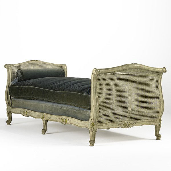 FRENCH DAYBED: FRENCH DAYBED; Caned head and footboard, velvet cushions with bolsters, 20th c.; 34'' x 88'' x 37''