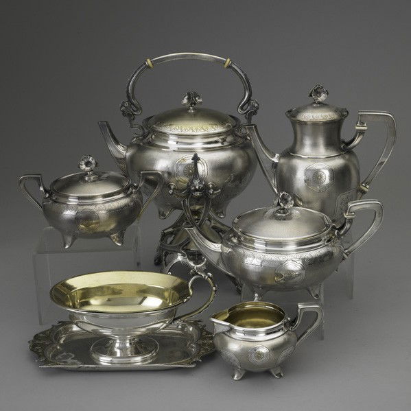 CHRISTOFLE ''CHINESE'' COFFEE SERVICE & SAUCE BOAT: CHRISTOFLE ''CHINESE'' COFFEE SERVICE AND SAUCE BOAT, 1862-1885. French silver-plated service with gilt rosettes, floral panels and palmette bands on engine turned ground, lily blossom finials and ivo