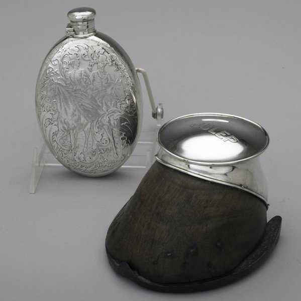 TIFFANY & CO. EQUESTRIAN MOTIF SILVER: TIFFANY & CO. EQUESTRIAN MOTIF SILVER, 1892-1907. Silver mounted horse hoof inkwell inscribed ''Julep'', 1902-1907; etched oval 1 1/2 gills hip flask depicts mounted gentry among foliage, 1892-1902, 5