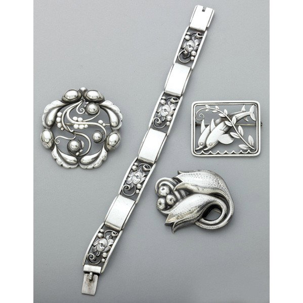 GEORG JENSEN AND OTHER DANISH SILVER JEWELRY: GEORG JENSEN AND OTHER DANISH SILVER JEWELRY, 1945-1965. Three brooches by Jensen: #251, leaping dolphins; 100c hammered bud; #159 circle brooch with ''silver pearls''; unidentified constructed foliat