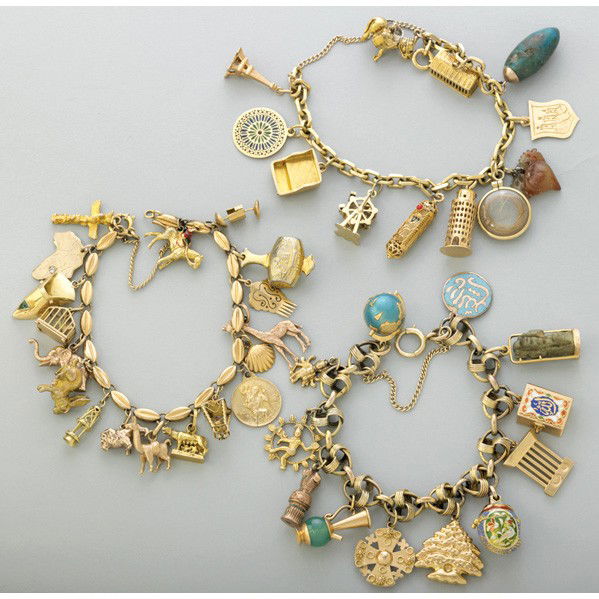 THREE FIGURAL CHARM BRACELETS: THREE FIGURAL CHARM BRACELETS. Mid 20th Century. Two gold and one gold-filled link bracelets suspend thirty-seven gold, two gold filled and two hardstone figural charms, 9 ct., 10k, 14k, 18k. 94 dwt.