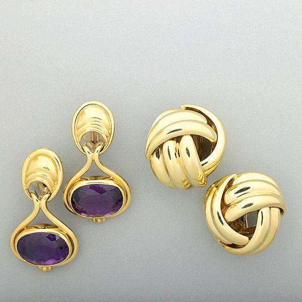 TWO PAIRS OF TAILORED GOLD EAR CLIPS: TWO PAIRS OF TAILORED GOLD EAR CLIPS, ca. 1990. Bright 18k button knots, Italy; oval amethysts in 14k pendant earrings. 36.6 dwt. GW (56.9 gs. GW), largest 1 1/2''