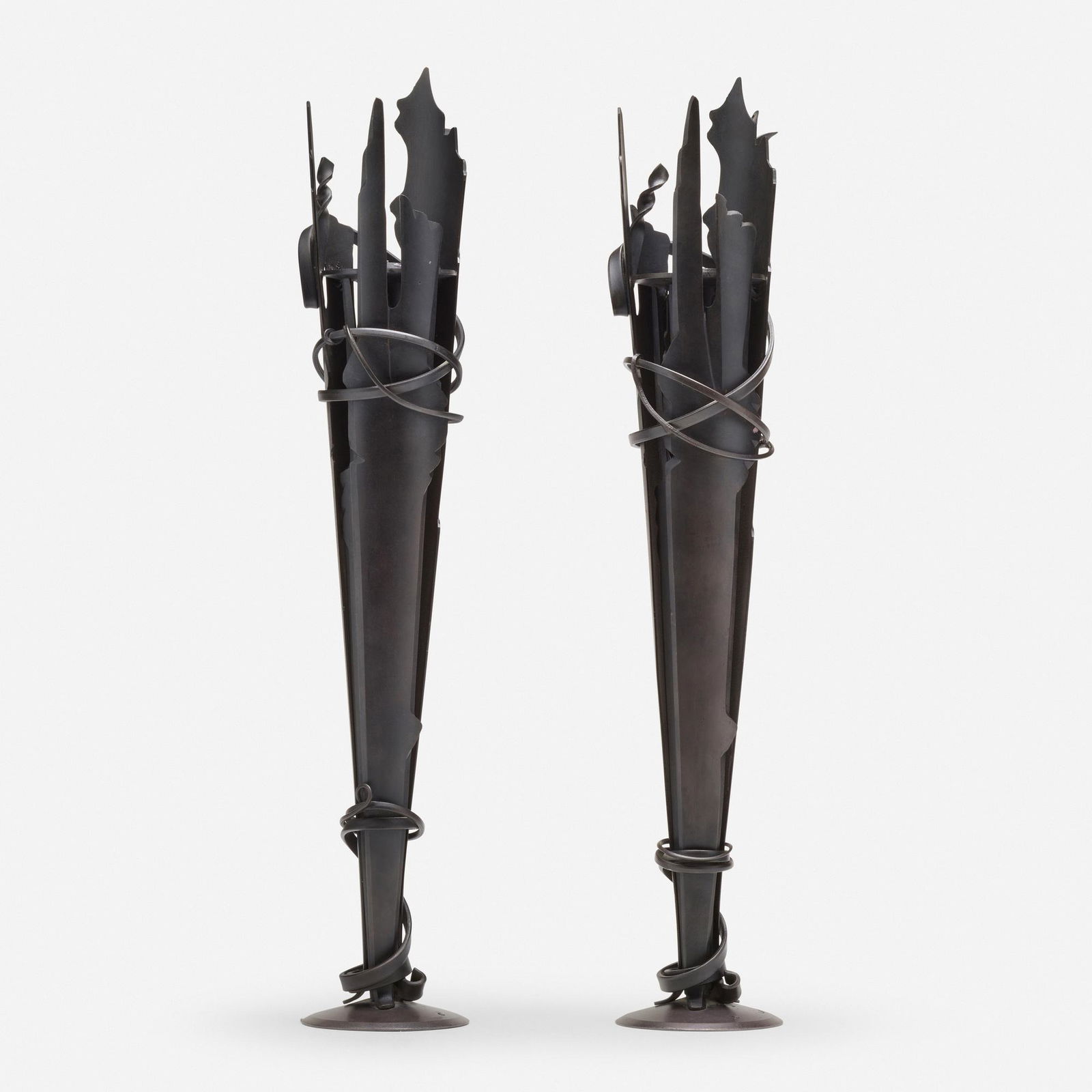 Albert Paley, Vulcan candleholders, pair: Albert Paley Vulcan candleholders, pair USA, 1994formed and fabricated steel with a blackened finish 20.25 h x 4.5 dia in (51 x 11 cm) Impressed signature and date to top of base of each examp