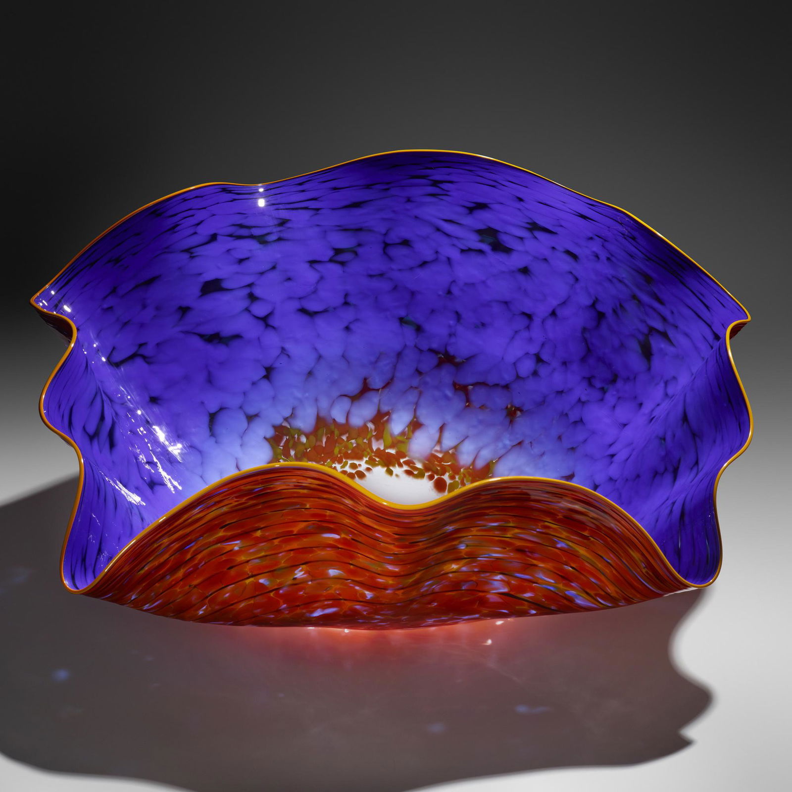 Dale Chihuly, Blue Macchia with Yellow Lip Wrap: Dale Chihuly Blue Macchia with Yellow Lip Wrap USA, 1996hand-blown glass 18.5 h x 35 dia in (47 x 89 cm) A monumental example of this form. Etched signature and date to base 'Chihuly 96'. <
