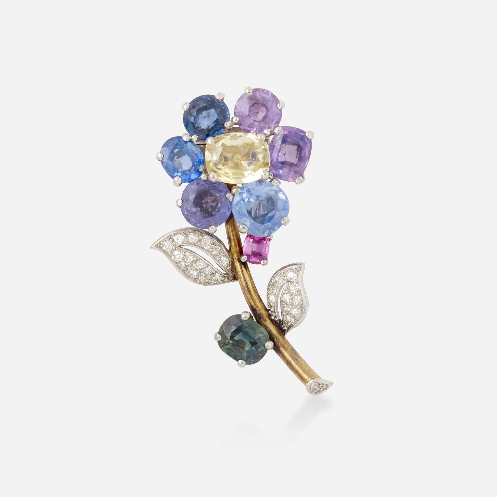 Cartier, attribution, Sapphire flower brooch: Cartier, attribution Colored sapphire and diamond flower brooch Sold to benefit Village Health Works Set with variously-cut blue, purple, pink, yellow, and green sapphires, and old mine-cut diamonds; 