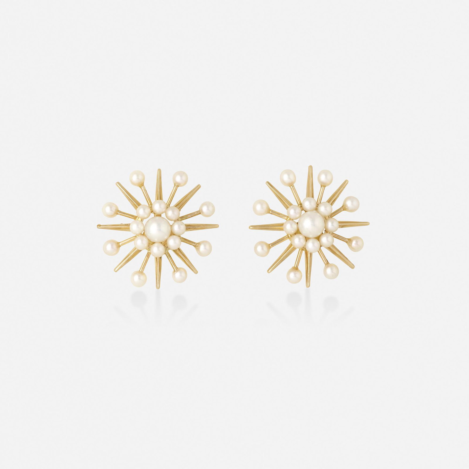 Fisher & Co., Cultured pearl and gold earrings: Fisher & Co. Cultured pearl and gold earrings Of starburst design; 1960s 14k yellow gold 1 in; Gross weight 4.3 dwts This work will ship from Lambertville, New Jersey.