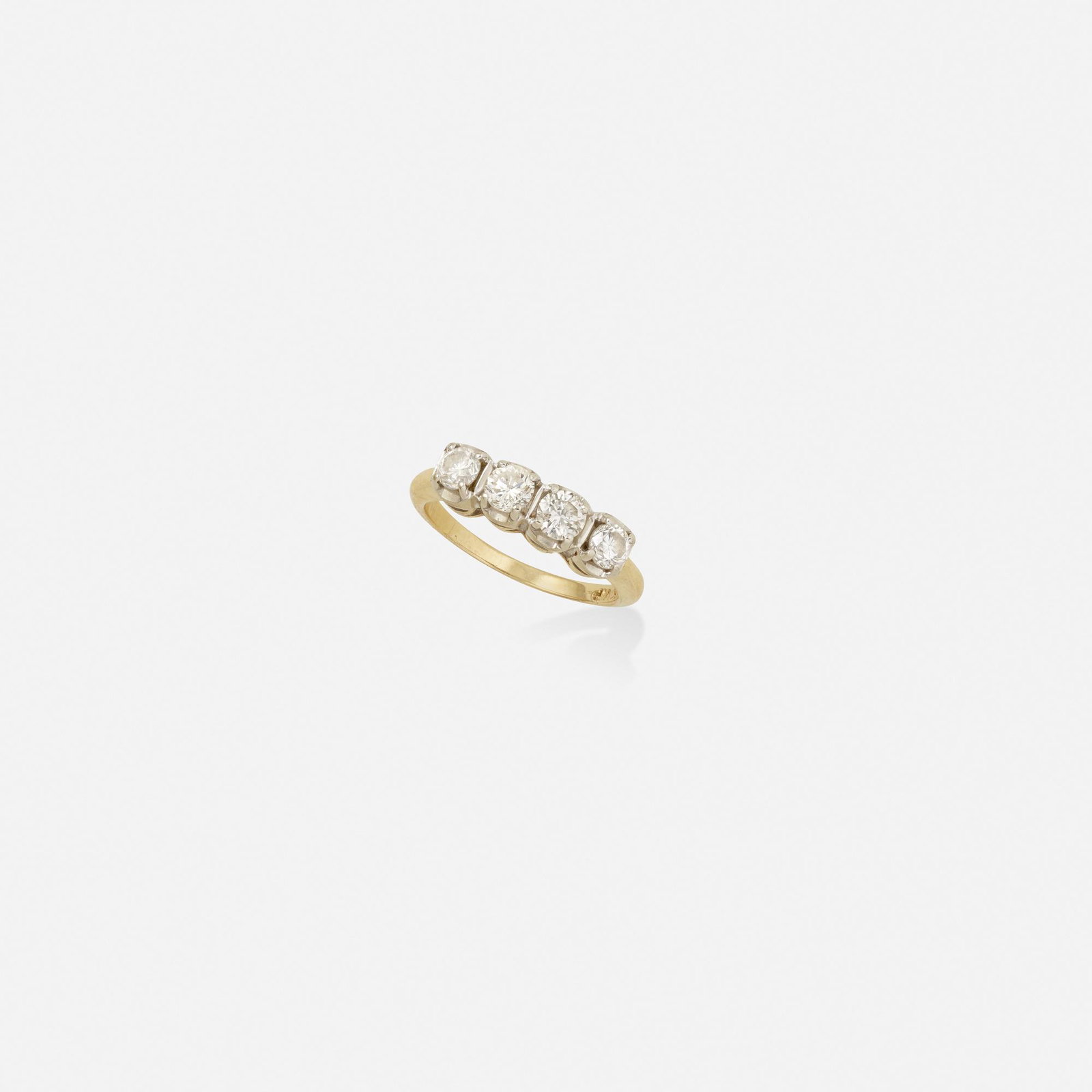 Diamond and gold ring: Diamond and gold ring Set with four round brilliant-cut diamonds 14k yellow and white gold Ring size 6.75; Gross weight 2.0 dwts This work will ship from Lambertville, New Jersey.
