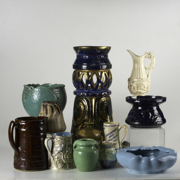 ART POTTERY: ART POTTERY; Twelve pieces: Matt Morgan umbrella stand, Stangl low bowl, spittoon, teal planter, five handled vessels and three vases; Some marked; Umbrella stand 21''