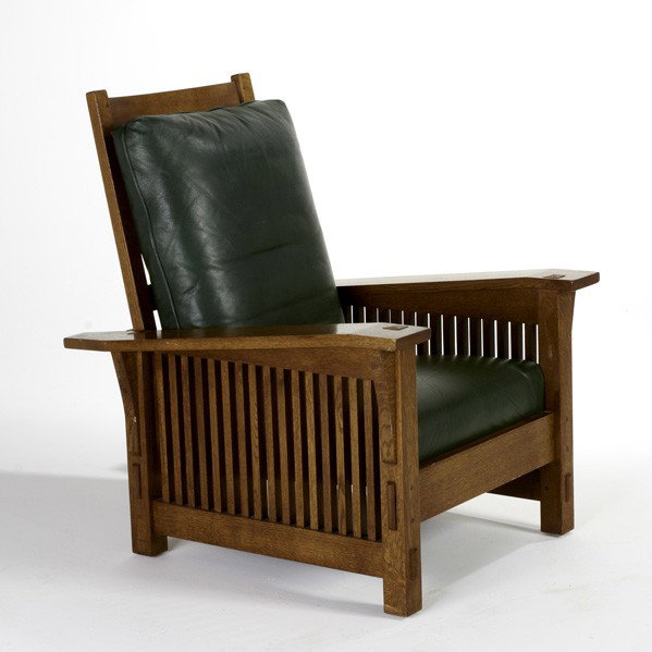 STICKLEY BY AUDI: STICKLEY BY AUDI; Contemporary drop-arm Morris chair, late 20th c.; Quartersawn oak and leather cushions; Branded/ metal tag; 41 1/2'' x 37 1/2'' x 33''