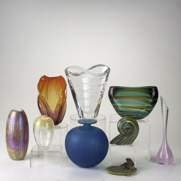 ART GLASS GROUP: ART GLASS GROUP; Nine pieces: Baccarat crystal vase, Floris Meydam/Leerdam green pillow vase, Madina blue vase, La Rochere bud vase, pate de verre frog on lily pad, etc; Tallest: 10 1/2''