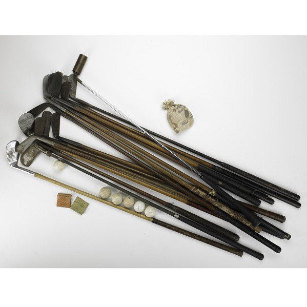 GOLF ACCESSORIES: GOLF ACCESSORIES; Approx. sixty- five pieces, 19th/20th c.: fifteen golf clubs including two prototypes, four smooth head, two Dunlop U. S. Army balls and tees in bag labeled ''It's Wilson Today in Go