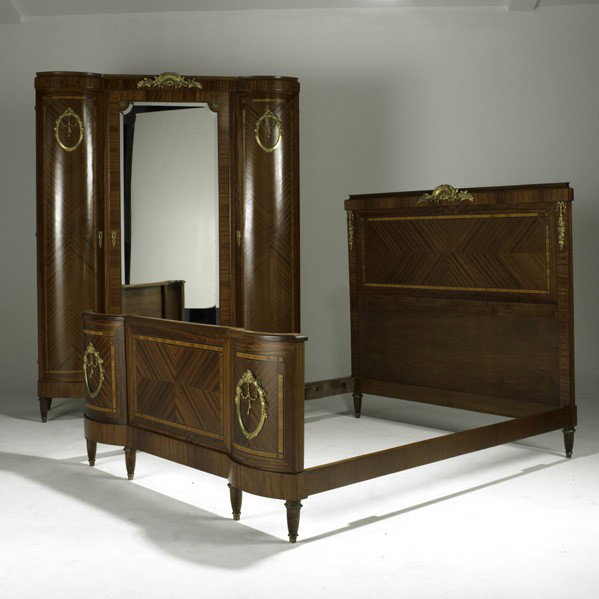 FRENCH ART DECO; Armoire and queen-size bed: FRENCH ART DECO; Armoire and queen-size bed suite, French, 1930s; Mahogany with string inlay and parquetry, ormolu decoration; Armoire: 88'' x 67'' x 23'' and bed: 59'' x 82'' x 64''