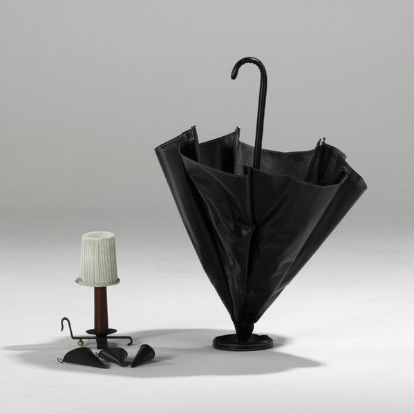 STYLE OF JACQUES ADNET: STYLE OF JACQUES ADNET; Two pieces: umbrella stand and chamberstick table lamp; Stitched vinyl and plastic; Unmarked; 39'' x 28''
