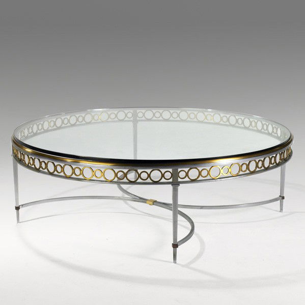MAISON JANSEN: MAISON JANSEN; Large coffee table, France, 1970's; Chrome plated steel, brass and glass; Unmarked; 19 1/4'' x 58 1/2'' dia.