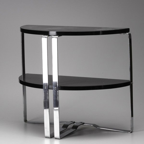 WOLFGANG HOFFMAN; HOWELL: WOLFGANG HOFFMAN; HOWELL; Two-tiered, demi-lune console table; chromed steel and black lacquered wood; Unmarked; 22'' x 26'' x 13''