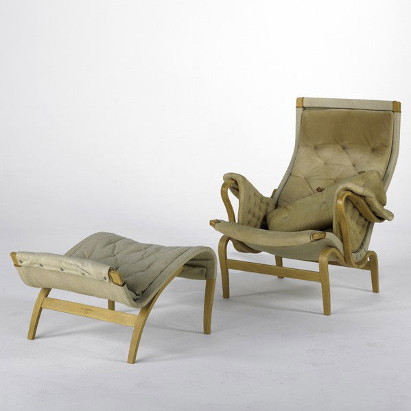 BRUNO MATHSSON; DUX: BRUNO MATHSSON; DUX; Pernilla lounge chair and ottoman, Sweden, 1970s; Laminated beech, canvas and leather; Branded; Chair: 38'' x 34'' x 35'' and ottoman: 16'' x 25'' x 26''