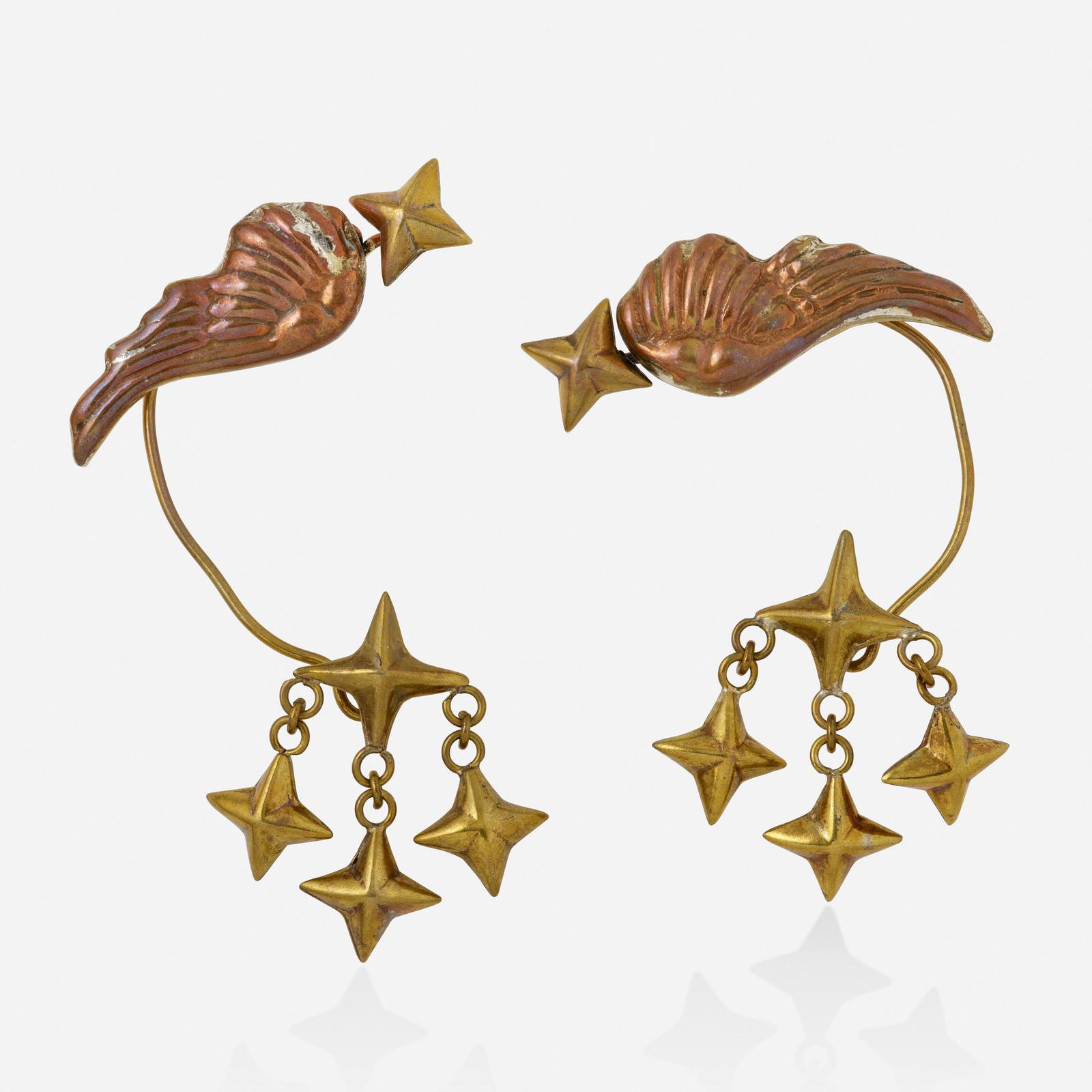 Hubert Harmon, Bronze and copper ear cuffs: Hubert Harmon Bronze and copper ear cuffs Before becoming a jeweler and painter, Hubert Harmon had designed fashion for Schiaperelli, Jean Patou, Elizabeth Arden, and Marcel Rochas. By way of NYC, he