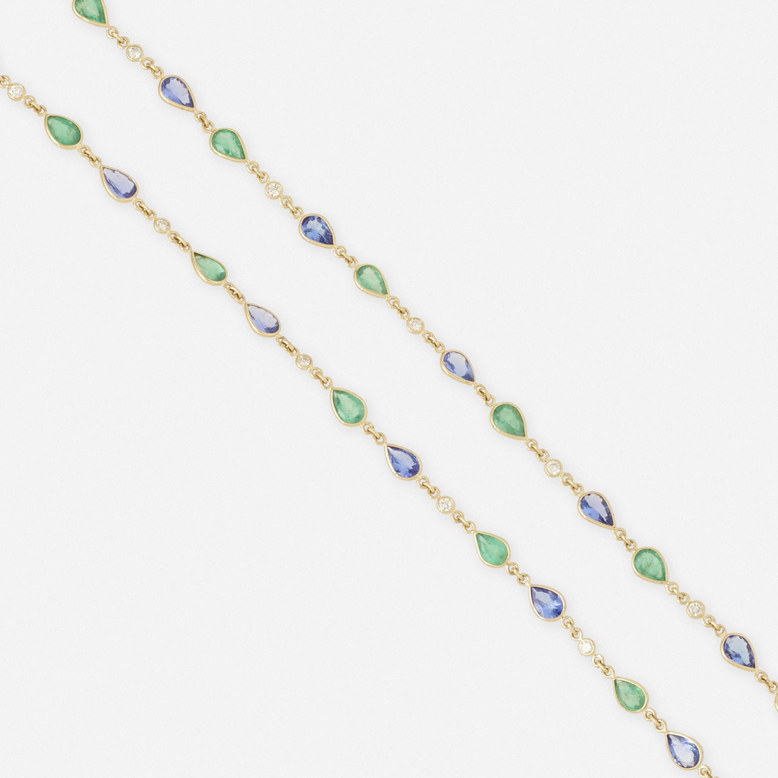 Emerald, tanzanite, and diamond necklace: Emerald, tanzanite, and diamond necklace Bezel-set with pear-shaped emeralds and tanzanites, spaced by round brilliant-cut diamonds Yellow gold 28 in; Gross weight 7.9 dwts