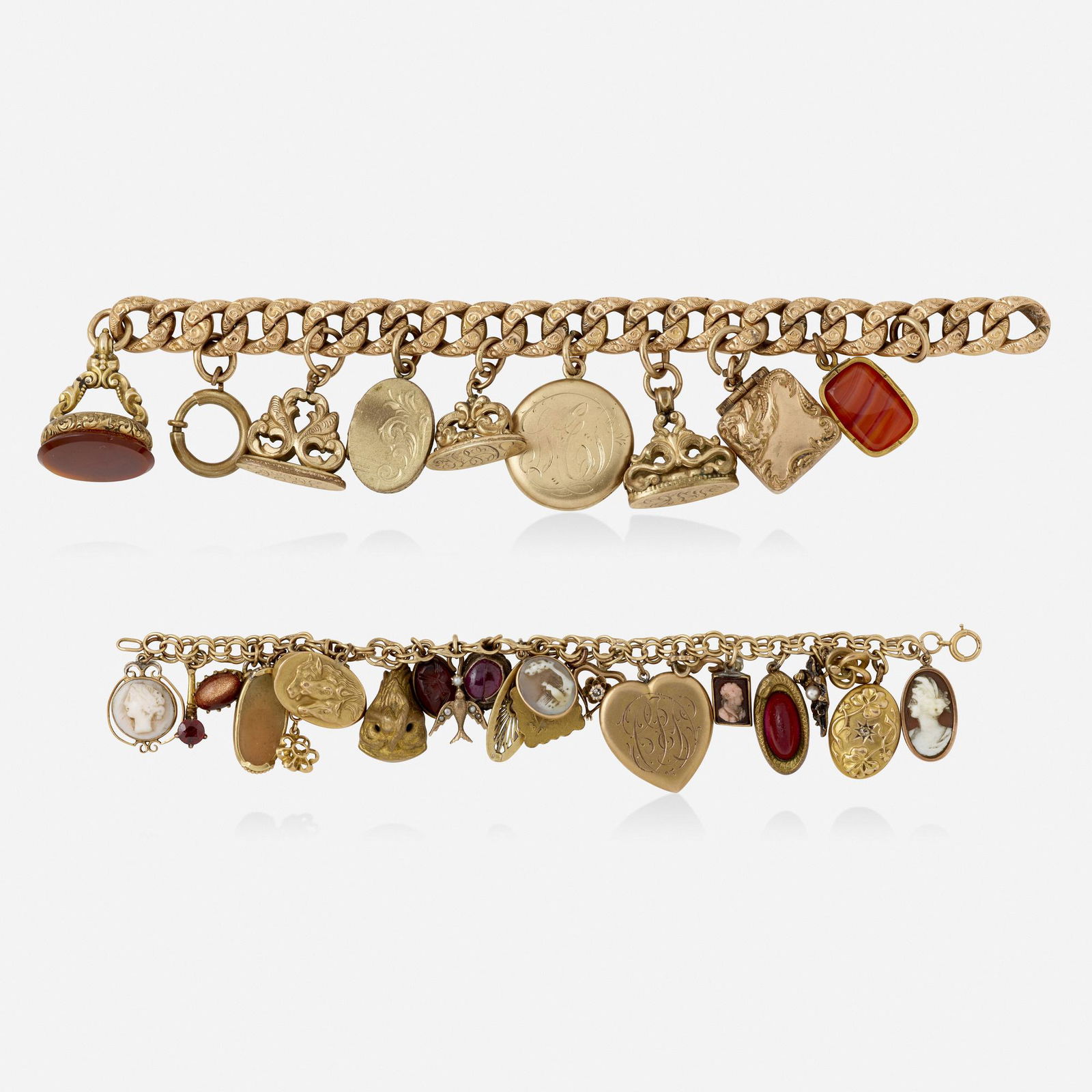 Antique, Two charm bracelets: Antique Two charm bracelets Comprising a bracelet with eight charms including three lockets; and a bracelet of 22 charms including a seed pearl bird, a monogrammed heart, and several cameos; 1900s Yel