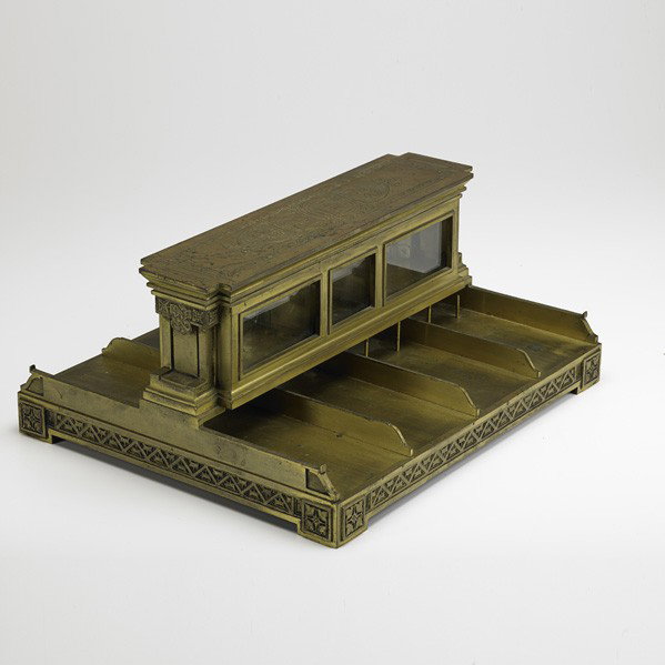 LOUIS SULLIVAN (Attr.); Bank deposit slip holder: LOUIS SULLIVAN (Attr.); Bank deposit slip holder, Midwestern US, ca. 1915; Parcel gilt bronze, glass; Stamped, numbers and letters; 7'' x 15 1/2'' x 13 1/2''